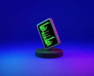 A smartphone displaying green computer code stands upright on a round, dark platform. The background fades from deep blue at the top to purple at the bottom, creating a futuristic and digital ambiance.
